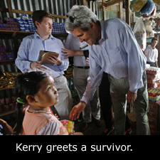 Kerry greets a survivor.